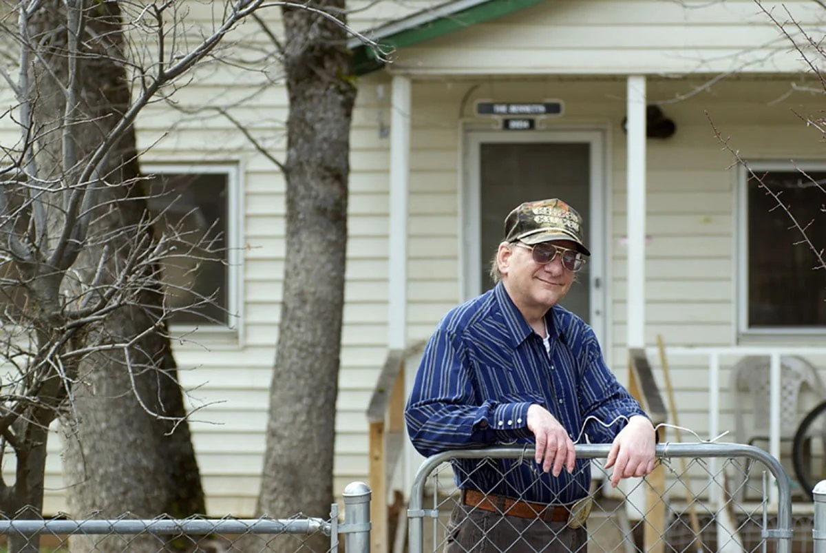 Michael Bennett in front of his home.