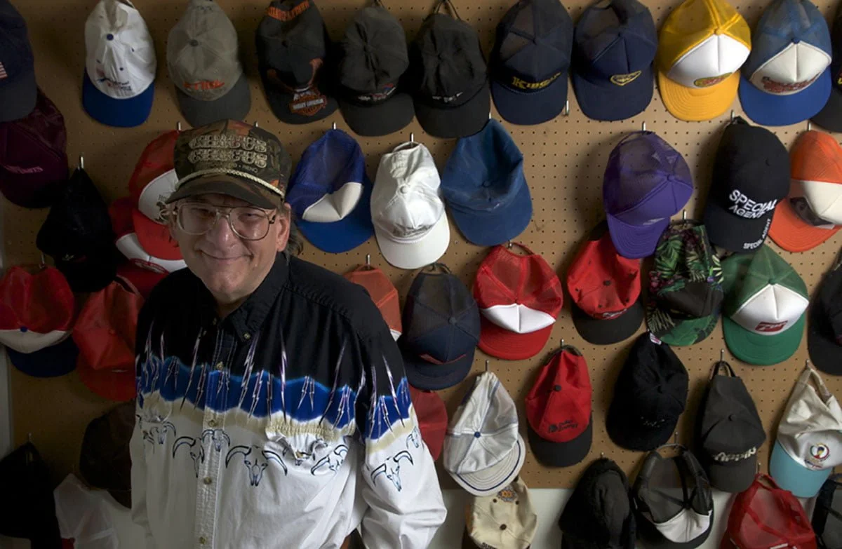 Michael Bennett with his hat collection.