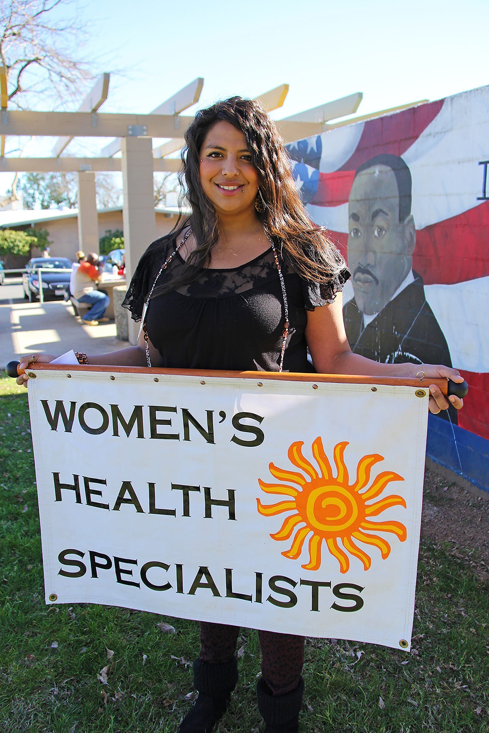 Danielle Brewster with Women's Health Specialists banner.