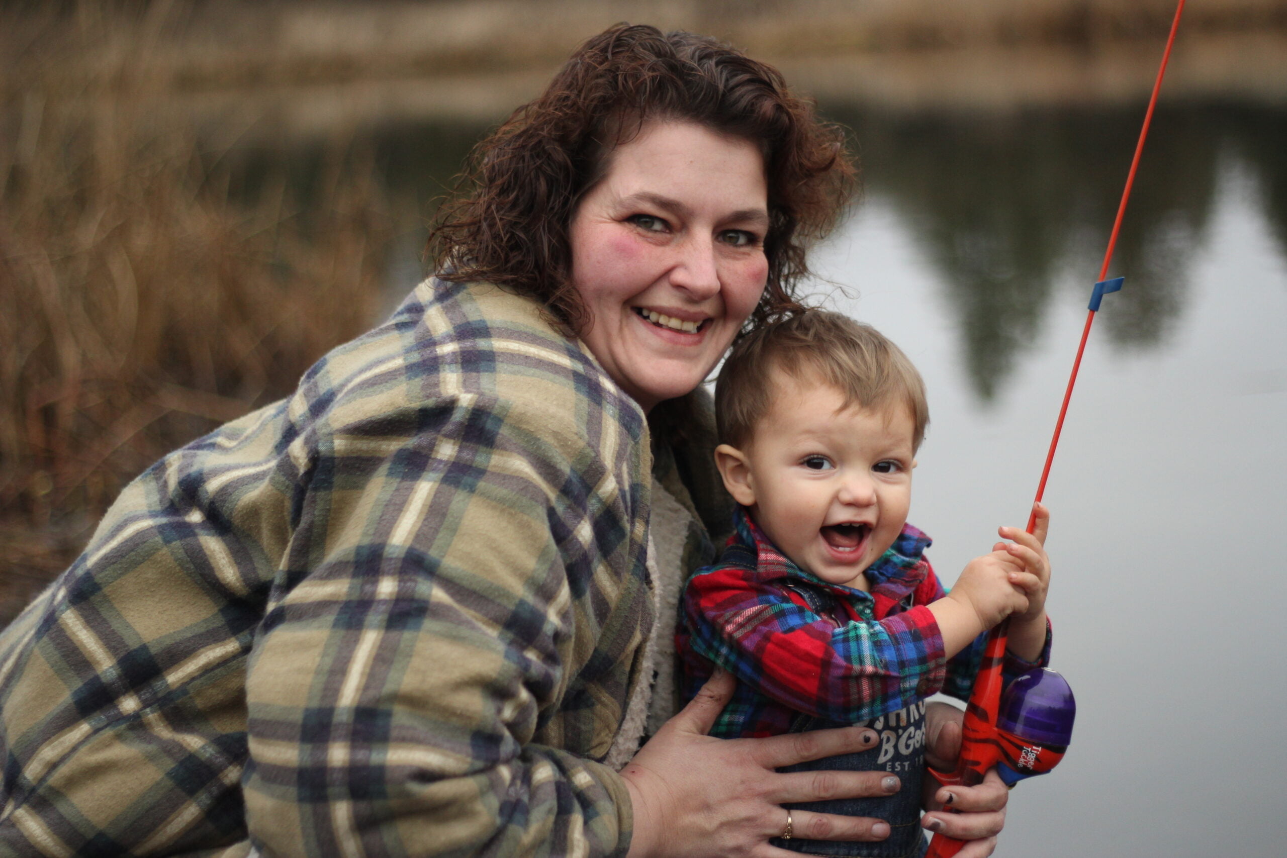 Tammy Hebert fishing with her grandson.